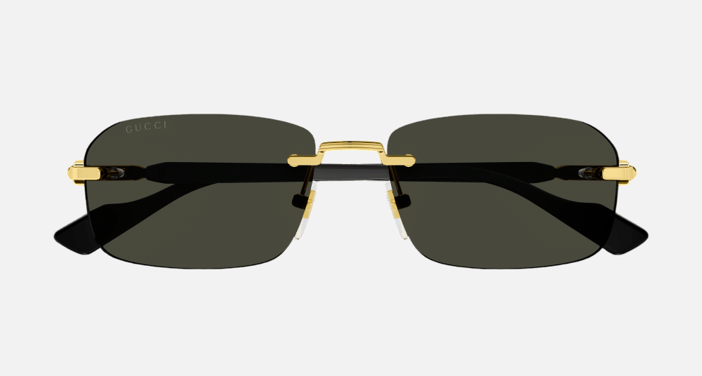 Gucci GG1221S 001 rectangular sunglasses for men in rimless metal, with gold frame, and grey lenses. 56mm in lens size, 16mm in bridge size, and 140mm in temple length.
