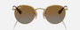Ray-Ban Junior Round Kids RJ9547S 223/T5 round sunglasses for kids in full rim metal, with polished arista gold frame, and brown polarized lenses. 44mm in lens size, 19mm in bridge size, and 130mm in temple length.