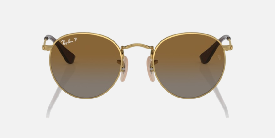 Ray-Ban Junior Round Kids RJ9547S 223/T5 round sunglasses for kids in full rim metal, with polished arista gold frame, and brown polarized lenses. 44mm in lens size, 19mm in bridge size, and 130mm in temple length.