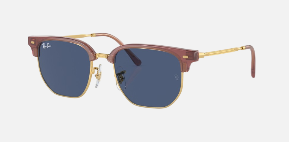Ray-Ban Junior New Clubmaster RJ9116S 715680 irregular sunglasses for kids in full rim injected, with opal pink on gold frame, and dark blue lenses. 47mm in lens size, 17mm in bridge size, and 125mm in temple length.