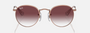 Ray-Ban Junior Round Kids RJ9547S 291/8H round sunglasses for kids in full rim metal, with polished rose gold frame, and violet lenses. 44mm in lens size, 19mm in bridge size, and 130mm in temple length.