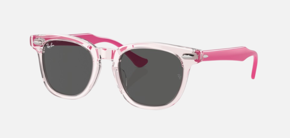 Ray-Ban Junior RJ9098S 716487 square sunglasses for kids in full rim acetate, with transparent pink frame, and dark grey lenses. 45mm in lens size, 18mm in bridge size, and 130mm in temple length.