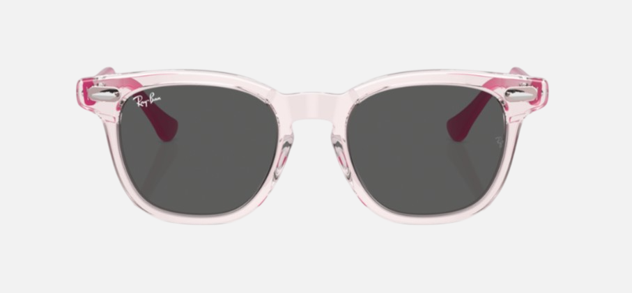 Ray-Ban Junior RJ9098S 716487 square sunglasses for kids in full rim acetate, with transparent pink frame, and dark grey lenses. 45mm in lens size, 18mm in bridge size, and 130mm in temple length.