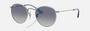 Ray-Ban Junior Round Kids RJ9547S 212/4L round sunglasses for kids in full rim metal, with polished silver frame, and grey/blue lenses. 44mm in lens size, 19mm in bridge size, and 130mm in temple length.