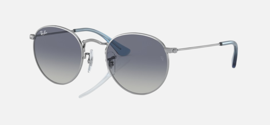 Ray-Ban Junior Round Kids RJ9547S 212/4L round sunglasses for kids in full rim metal, with polished silver frame, and grey/blue lenses. 44mm in lens size, 19mm in bridge size, and 130mm in temple length.
