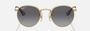 Ray-Ban Junior Round Kids RJ9547S 292/T3 round sunglasses for kids in full rim metal, with polished arista gold frame, and grey polarized lenses. 44mm in lens size, 19mm in bridge size, and 130mm in temple length.