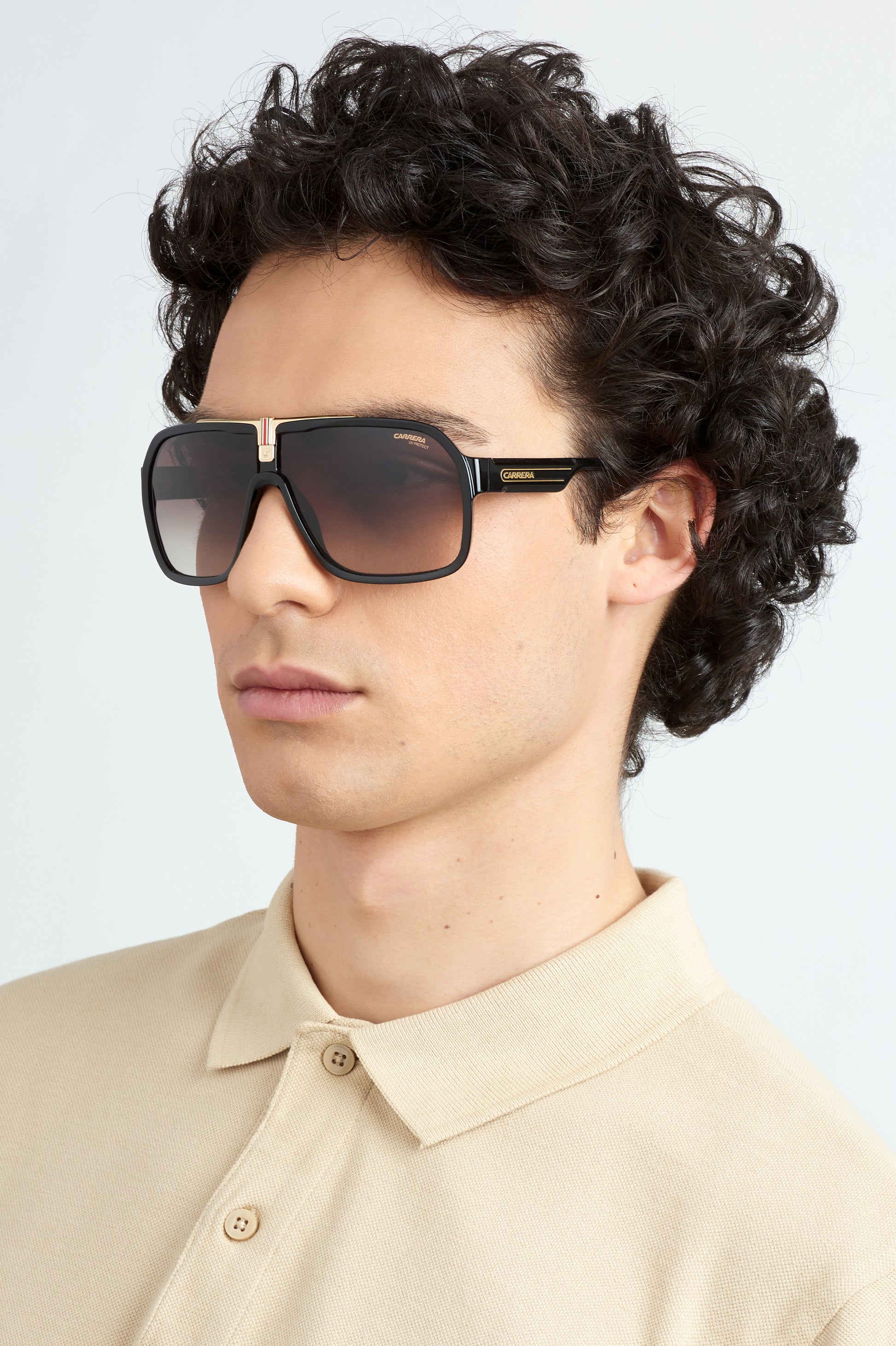 Carrera 1014/S 807 pilot sunglasses for men in full rim plastic, with black frame, and gradient brown lenses. 64mm in lens size, 10mm in bridge size, and 135mm in temple length.