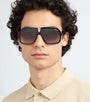 Carrera 1014/S 807 pilot sunglasses for men in full rim plastic, with black frame, and gradient brown lenses. 64mm in lens size, 10mm in bridge size, and 135mm in temple length.