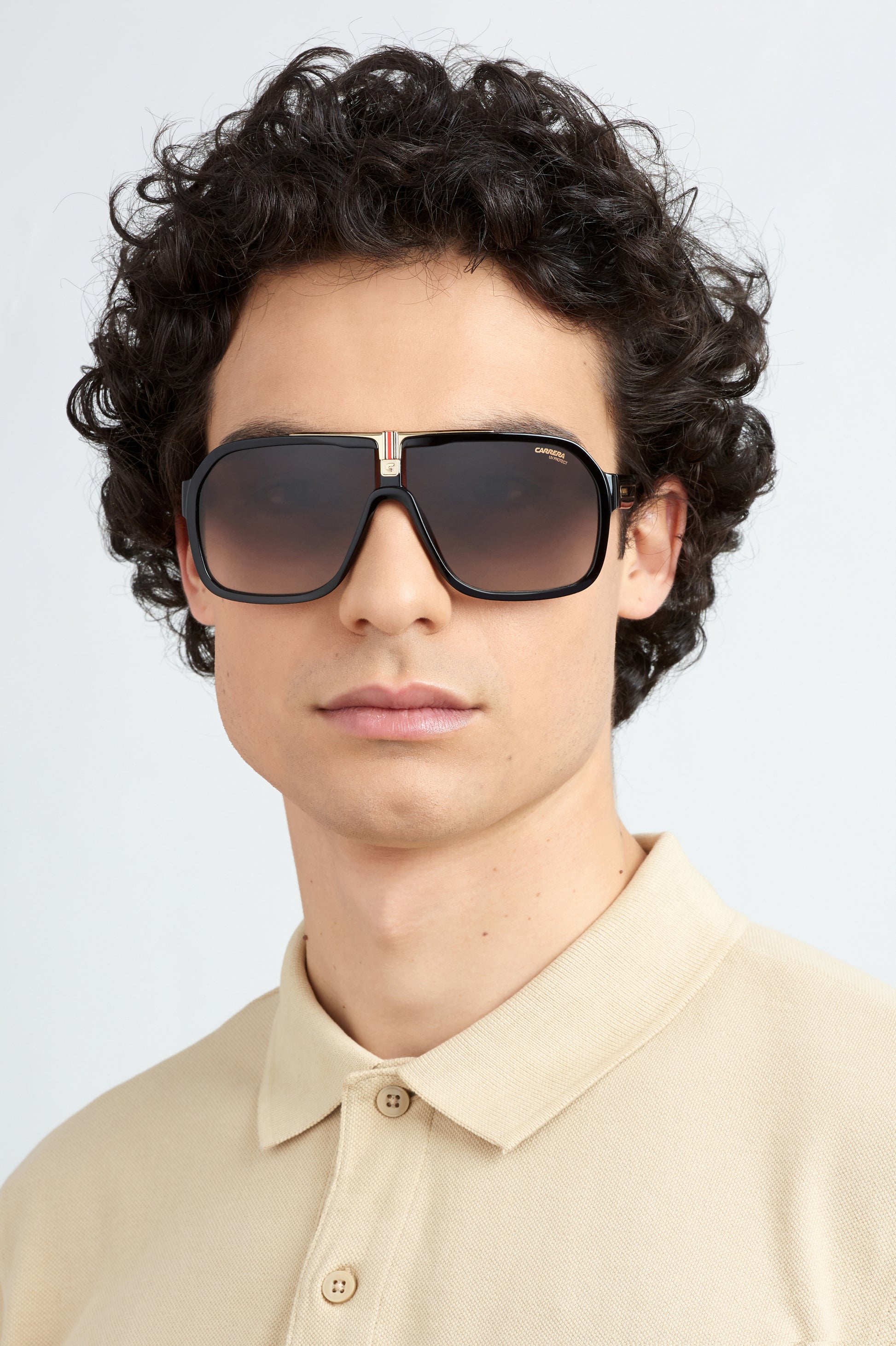 Carrera 1014/S 807 pilot sunglasses for men in full rim plastic, with black frame, and gradient brown lenses. 64mm in lens size, 10mm in bridge size, and 135mm in temple length.