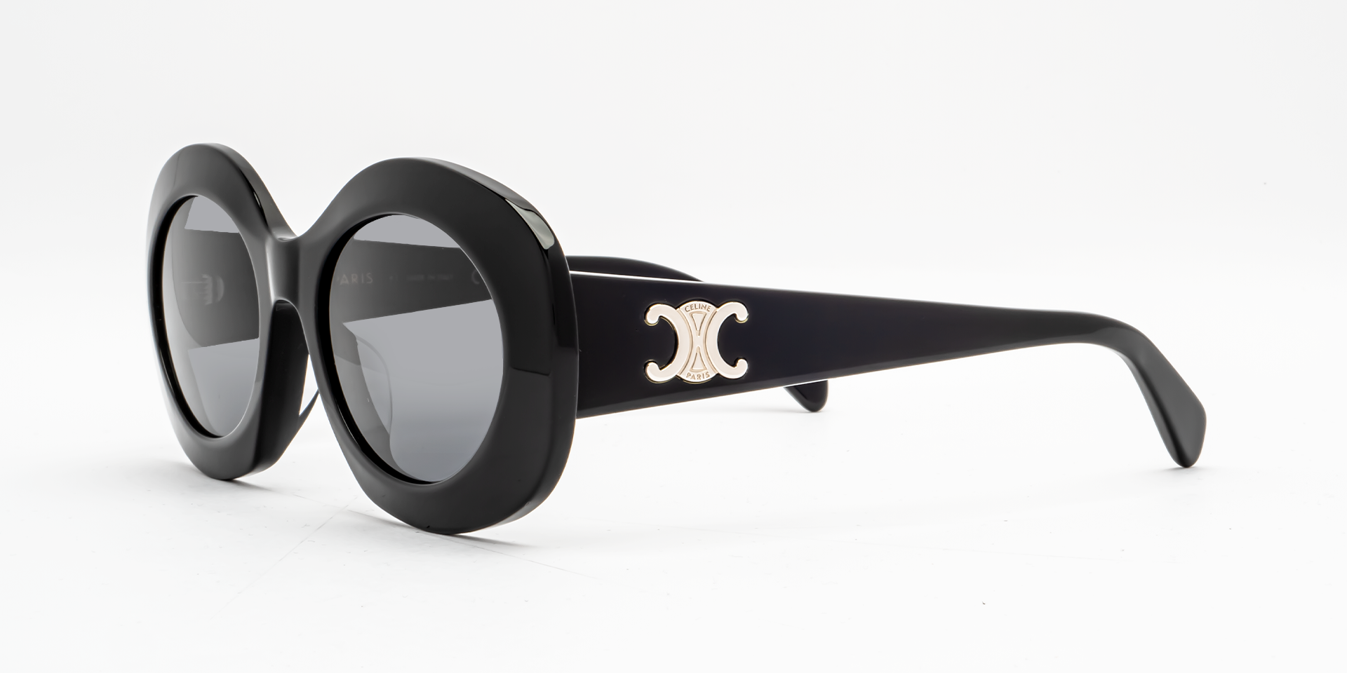 Celine Triomphe CL40292U 01A round sunglasses for women in full rim acetate, with black frame, and grey lenses. 54mm in lens size, 20mm in bridge size, and 140mm in temple length.