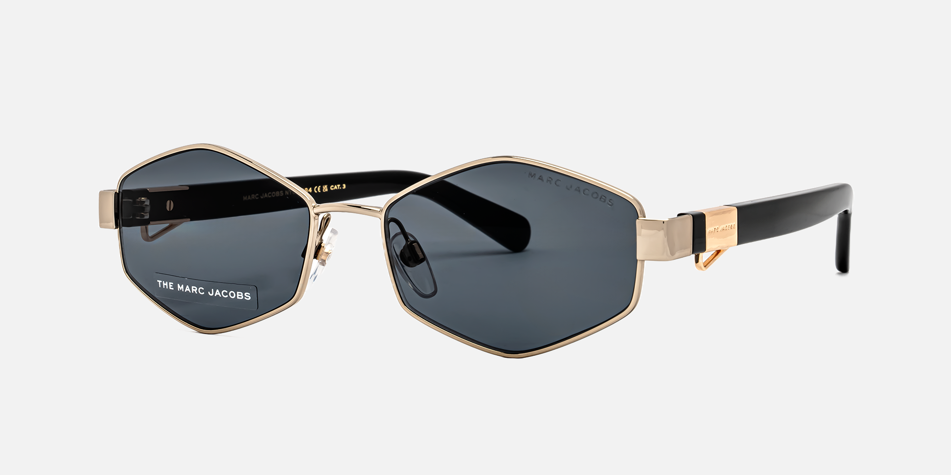 Marc Jacobs Marc 496/S J5G/IR hexagonal sunglasses for women in full rim metal, with gold frame, and grey lenses. 55mm in lens size, 17mm in bridge size, and 140mm in temple length.