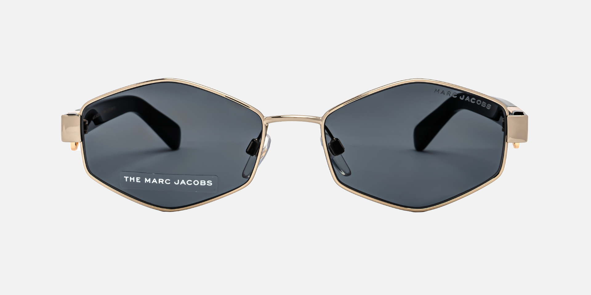 Marc Jacobs Marc 496/S J5G/IR hexagonal sunglasses for women in full rim metal, with gold frame, and grey lenses. 55mm in lens size, 17mm in bridge size, and 140mm in temple length.