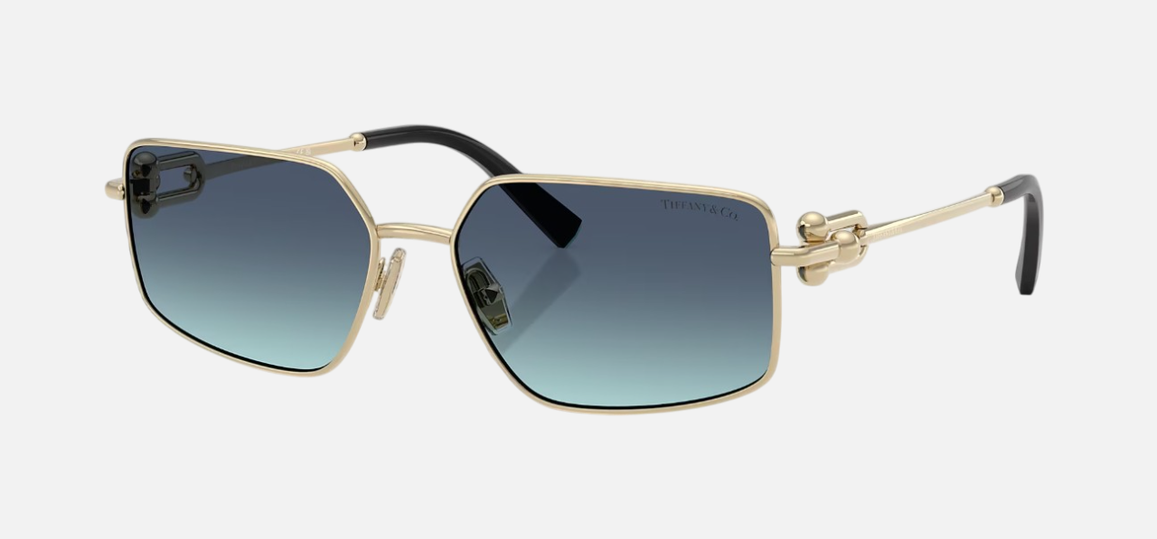 Tiffany TF3111 62029S irregular sunglasses for women in full rim metal, with pale gold frame, and blue gradient lenses. 58mm in lens size, 16mm in bridge size, and 140mm in temple length.
