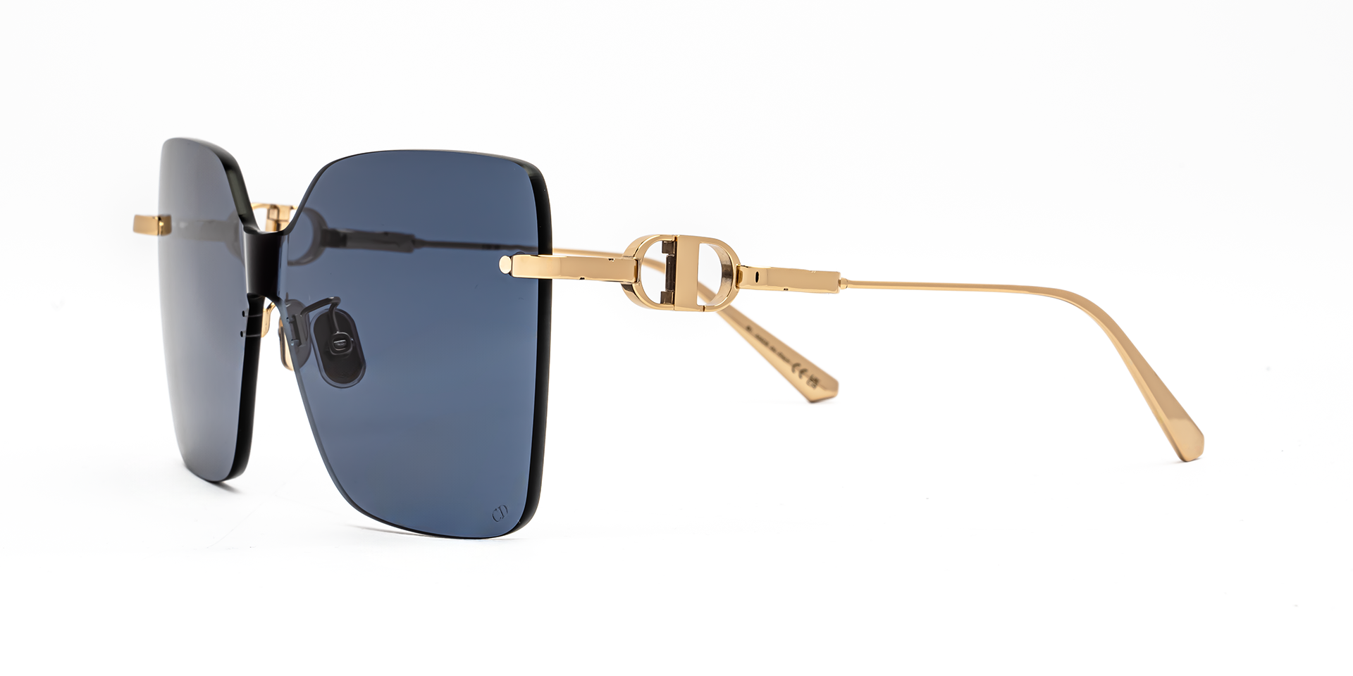 Christian Dior CD CHAIN M1U B0B0 shield sunglasses for women in rimless metal, with shiny gold frame, and blue lenses. 140mm in lens size, 0mm in bridge size, and 120mm in temple length.