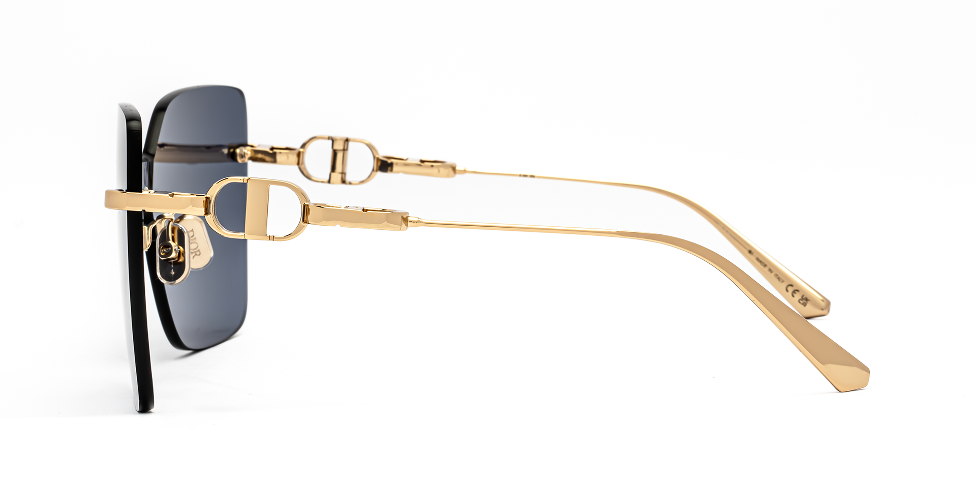 Christian Dior CD CHAIN M1U B0B0 shield sunglasses for women in rimless metal, with shiny gold frame, and blue lenses. 140mm in lens size, 0mm in bridge size, and 120mm in temple length.