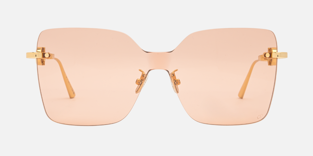 Christian Dior CD CHAIN M1U B0L0 shield sunglasses for women in rimless metal, with shiny gold frame, and light pink lenses. 140mm in lens size, 0mm in bridge size, and 120mm in temple length.