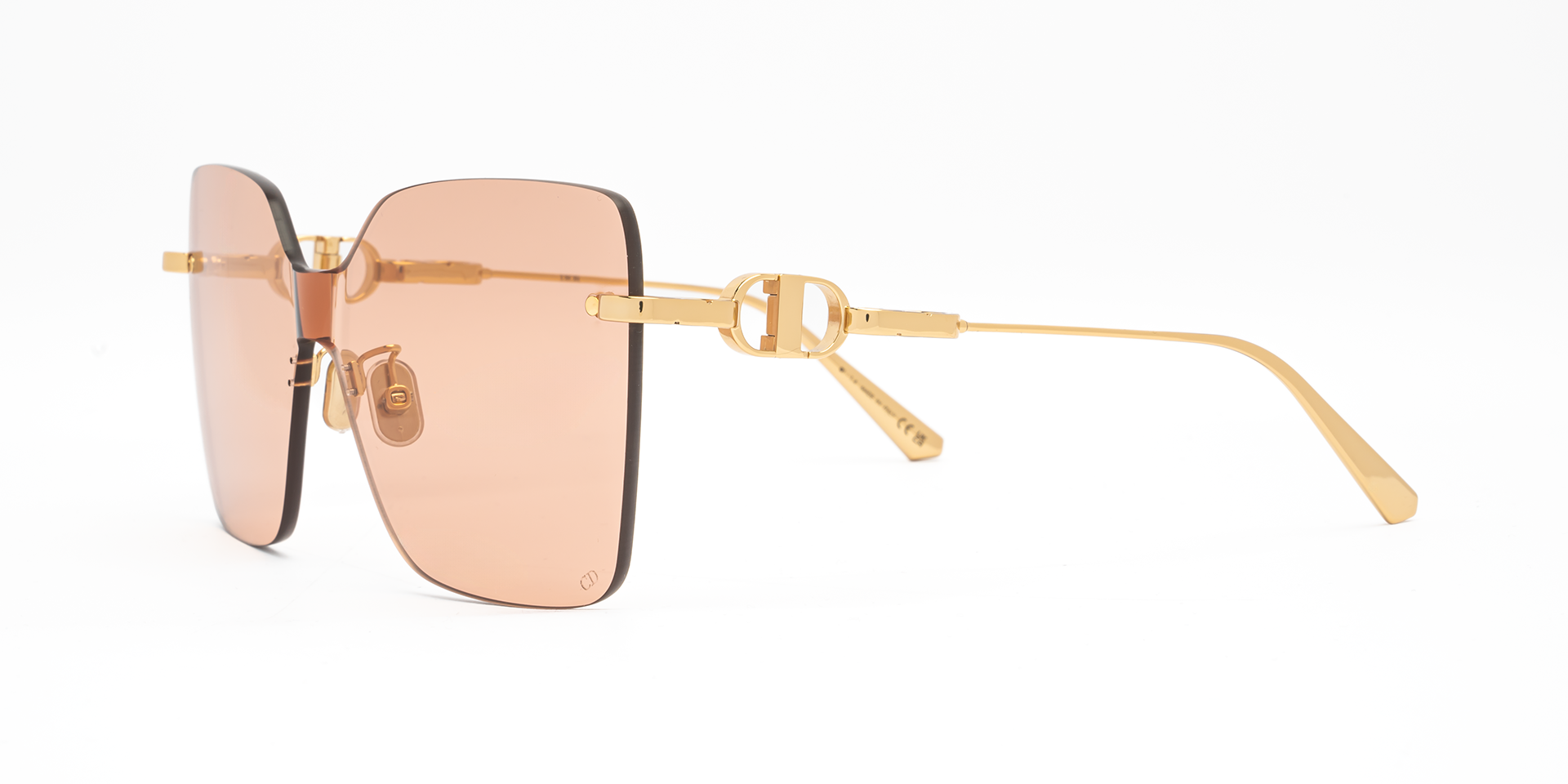 Christian Dior CD CHAIN M1U B0L0 shield sunglasses for women in rimless metal, with shiny gold frame, and light pink lenses. 140mm in lens size, 0mm in bridge size, and 120mm in temple length.