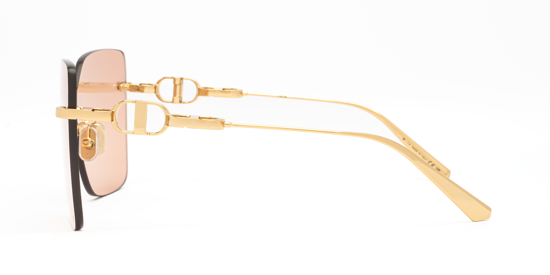 Christian Dior CD CHAIN M1U B0L0 shield sunglasses for women in rimless metal, with shiny gold frame, and light pink lenses. 140mm in lens size, 0mm in bridge size, and 120mm in temple length.