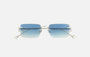 Eyepetizer Dillinger C.1-26 rectangular sunglasses for unisex in rimless steel, with silver frame, and blue gradient lenses. 52mm in lens size, 18mm in bridge size, and 145mm in temple length.