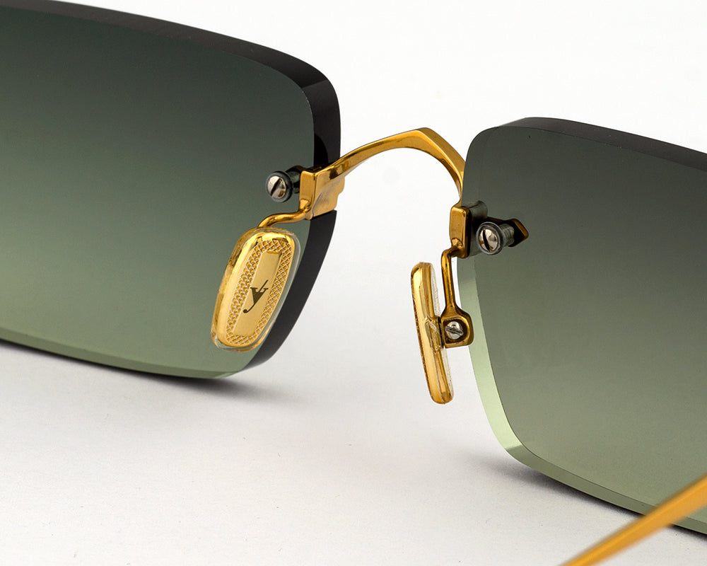Eyepetizer Etherege C.4-52 square sunglasses for unisex in rimless steel, with gold frame, and green gradient lenses. 52mm in lens size, 18mm in bridge size, and 145mm in temple length.