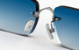 Eyepetizer Etherege C.1-53 rectangular sunglasses for unisex in rimless steel, with silver frame, and blue gradient lenses. 52mm in lens size, 18mm in bridge size, and 145mm in temple length.