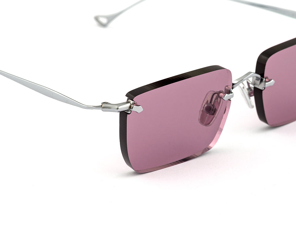 Eyepetizer Etherege C.1-55 rectangular sunglasses for unisex in rimless steel, with silver frame, and lilac lenses. 52mm in lens size, 18mm in bridge size, and 145mm in temple length.