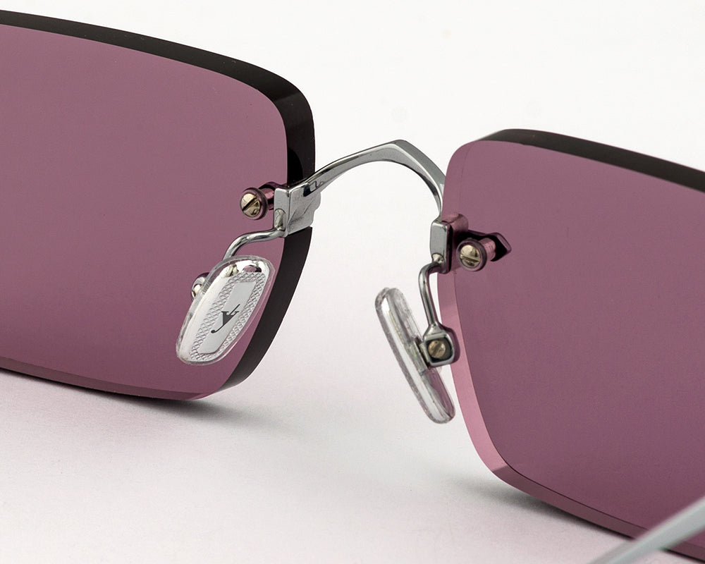 Eyepetizer Etherege C.1-55 rectangular sunglasses for unisex in rimless steel, with silver frame, and lilac lenses. 52mm in lens size, 18mm in bridge size, and 145mm in temple length.