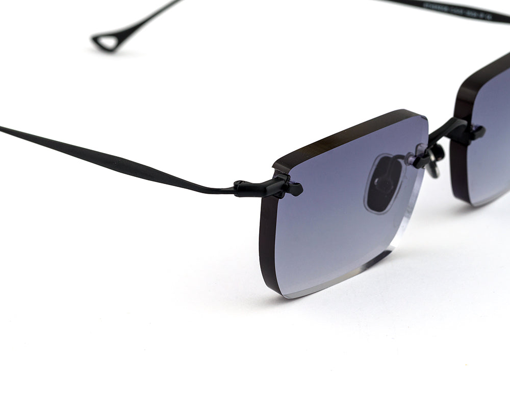 Eyepetizer Etherege C.6-51 square sunglasses for unisex in rimless steel, with black frame, and grey lenses. 52mm in lens size, 18mm in bridge size, and 145mm in temple length.