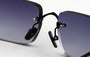 Eyepetizer Etherege C.6-51 square sunglasses for unisex in rimless steel, with black frame, and grey lenses. 52mm in lens size, 18mm in bridge size, and 145mm in temple length.