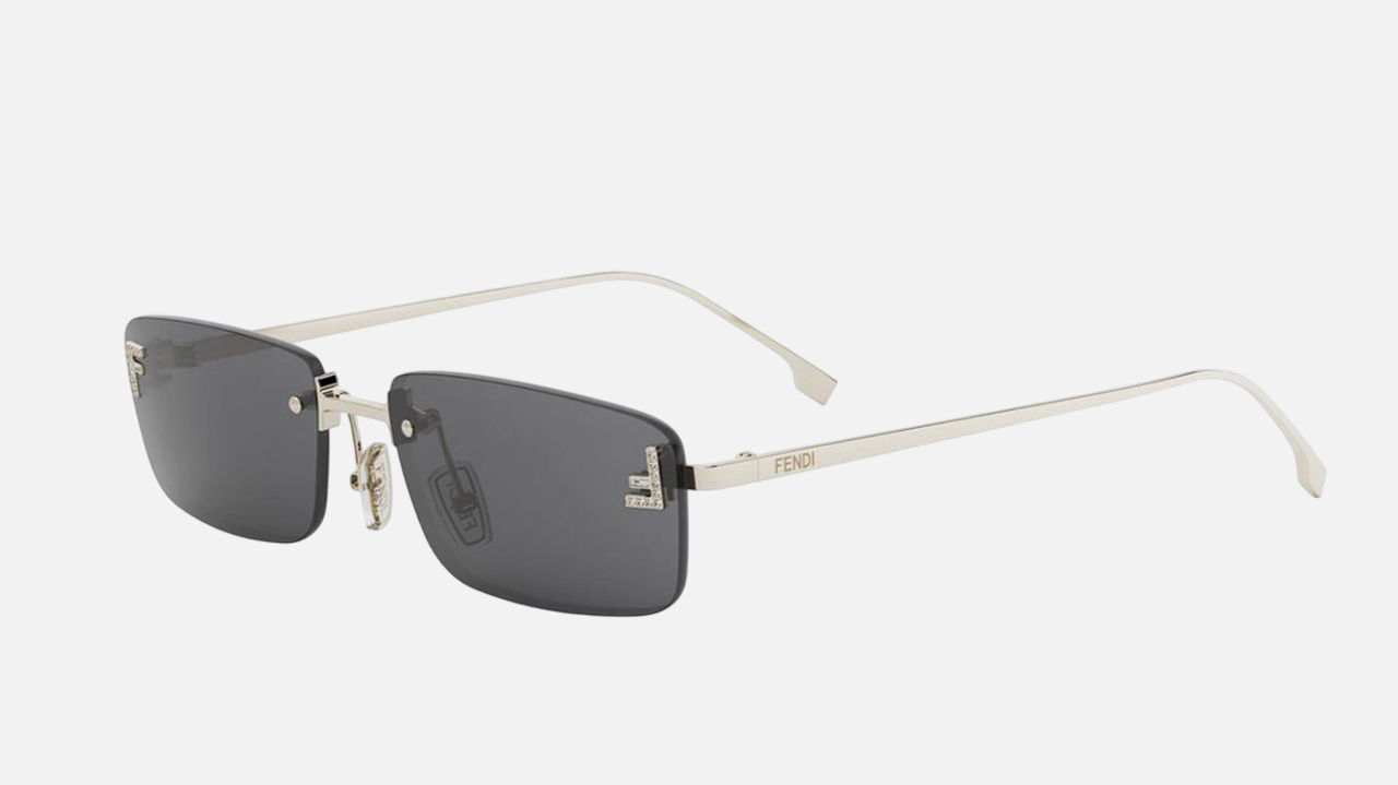 Fendi FE4172US 32A women's rimless rectangular sunglasses in a gold metal frame with grey lenses. Features a 54 mm lens size, 16 mm bridge size, and 135 mm temple length. Available in Dubai, UAE.