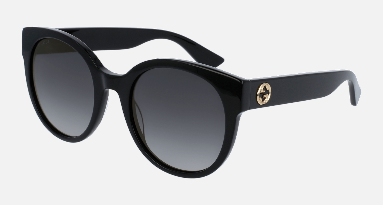 Gucci GG0035SN 001 round sunglasses for women in full rim acetate, with black frame, and grey gradient lenses. 54mm in lens size, 22mm in bridge size, and 140mm in temple length.