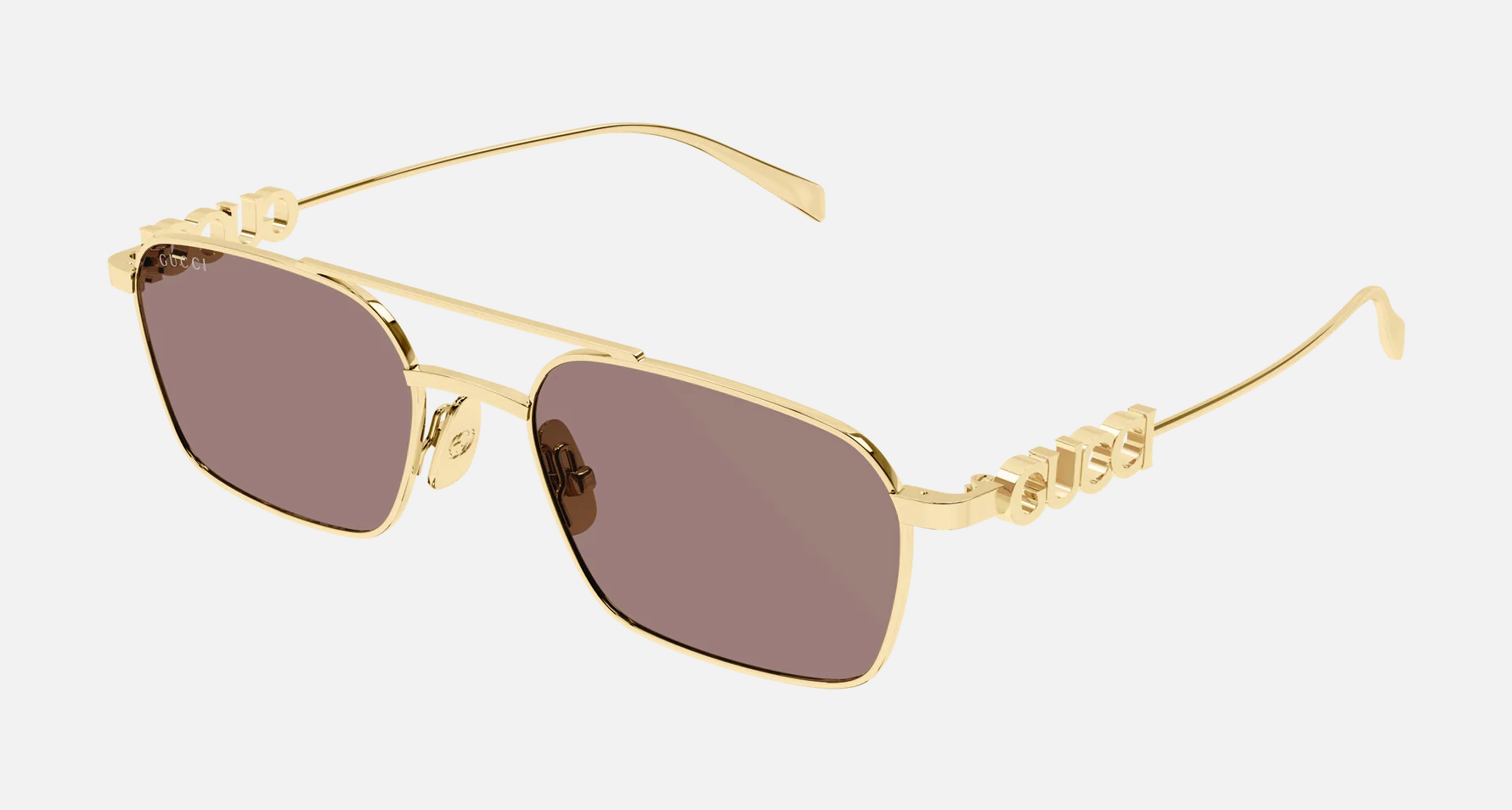 Gucci GG1804S 003 women's full rim pilot sunglasses in a gold metal frame with brown lenses. Features a 54 mm lens size, 19 mm bridge size, and 145 mm temple length. Available in Dubai, UAE.