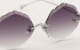 Eyepetizer Guadalupe C.1-60 irregular sunglasses for women in rimless steel, with silver frame, and grey gradient lenses. 56mm in lens size, 16mm in bridge size, and 145mm in temple length.