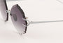 Eyepetizer Guadalupe C.1-60 irregular sunglasses for women in rimless steel, with silver frame, and grey gradient lenses. 56mm in lens size, 16mm in bridge size, and 145mm in temple length.