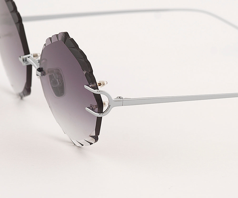 Eyepetizer Guadalupe C.1-60 irregular sunglasses for women in rimless steel, with silver frame, and grey gradient lenses. 56mm in lens size, 16mm in bridge size, and 145mm in temple length.