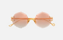 Eyepetizer Guadalupe C.4-61 irregular sunglasses for women in rimless steel, with gold frame, and orange gradient lenses. 56mm in lens size, 16mm in bridge size, and 145mm in temple length.