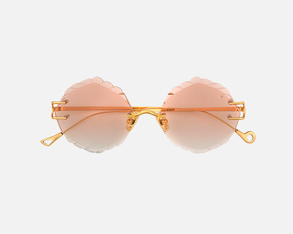 Eyepetizer Guadalupe C.4-61 irregular sunglasses for women in rimless steel, with gold frame, and orange gradient lenses. 56mm in lens size, 16mm in bridge size, and 145mm in temple length.