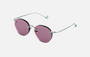 Eyepetizer Oxford C.1-55 round sunglasses for women in rimless steel, with silver frame, and lilac lenses. 51mm in lens size, 18mm in bridge size, and 145mm in temple length.