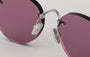 Eyepetizer Oxford C.1-55 round sunglasses for women in rimless steel, with silver frame, and lilac lenses. 51mm in lens size, 18mm in bridge size, and 145mm in temple length.