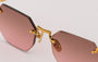Eyepetizer Panthere C.4-44 hexagonal sunglasses for women in rimless steel, with gold frame, and green gradient lenses. 52mm in lens size, 18mm in bridge size, and 145mm in temple length.