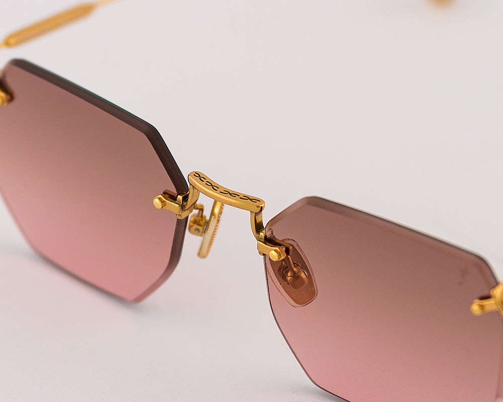 Eyepetizer Panthere C.4-44 hexagonal sunglasses for women in rimless steel, with gold frame, and green gradient lenses. 52mm in lens size, 18mm in bridge size, and 145mm in temple length.