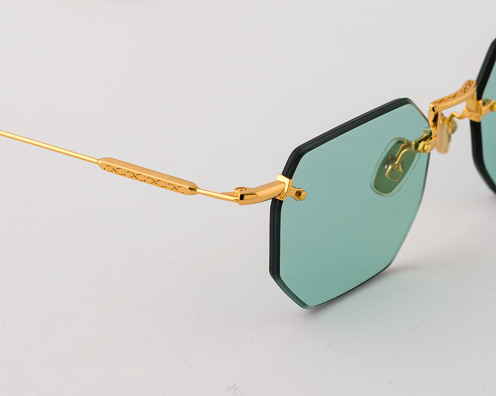 Eyepetizer Panthere C.4-48 irregular sunglasses for women in rimless steel, with gold frame, and aqua green lenses. 52mm in lens size, 18mm in bridge size, and 145mm in temple length.