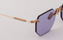Eyepetizer Panthere C.9-49 irregular sunglasses for women in rimless steel, with rose gold frame, and violet lenses. 52mm in lens size, 18mm in bridge size, and 145mm in temple length.