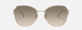 Prada PR 57YS ZVN3D0 irregular sunglasses for women in full rim metal, with pale gold frame, and light brown gradient lenses. 57mm in lens size, 18mm in bridge size, and 140mm in temple length.