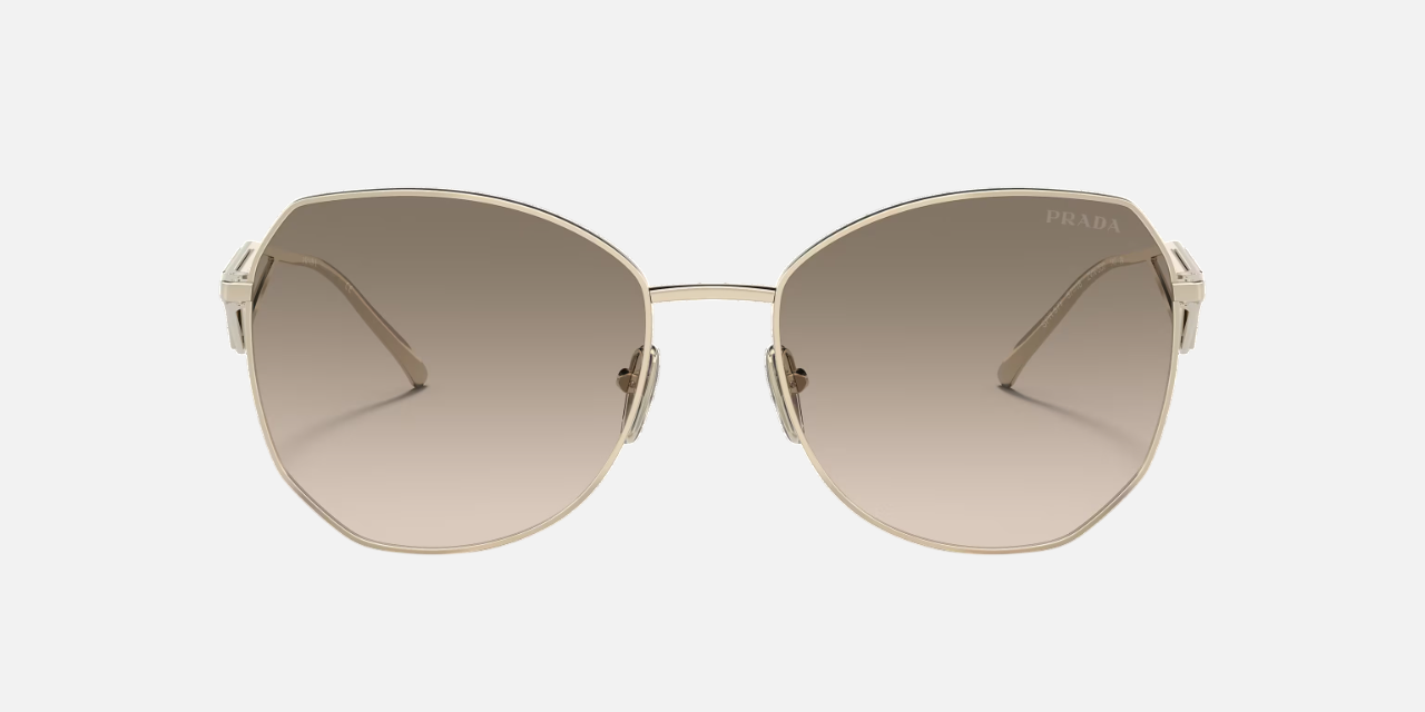 Prada PR 57YS ZVN3D0 irregular sunglasses for women in full rim metal, with pale gold frame, and light brown gradient lenses. 57mm in lens size, 18mm in bridge size, and 140mm in temple length.