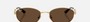 Ray-Ban RB3774D 001/73  unisex's full rim oval sunglasses in polished arista gold frame and dark brown lenses, with 55mm lens size, 19mm bridge size, and 145mm temple size. Available in Dubai, UAE.