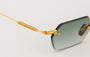 Eyepetizer Tank C.4-25 hexagonal sunglasses for women in rimless steel, with gold frame, and green gradient lenses. 52mm in lens size, 18mm in bridge size, and 145mm in temple length.