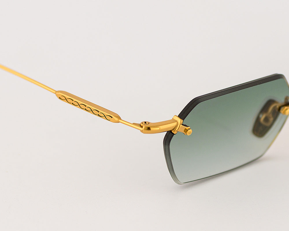 Eyepetizer Tank C.4-25 hexagonal sunglasses for women in rimless steel, with gold frame, and green gradient lenses. 52mm in lens size, 18mm in bridge size, and 145mm in temple length.