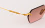 Eyepetizer Tank C.4-44 hexagonal sunglasses for women in rimless steel, with gold frame, and brown with pink gradient lenses. 52mm in lens size, 18mm in bridge size, and 145mm in temple length.