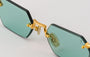 Eyepetizer Tank C.4-48 hexagonal sunglasses for women in rimless steel, with gold frame, and aqua green lenses. 52mm in lens size, 18mm in bridge size, and 145mm in temple length.